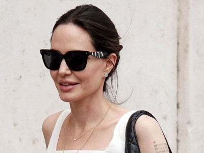 Angelina Jolie Walks Streets of Rome in Breezy White Ensemble
