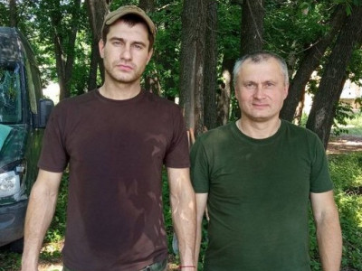 Father Yury Stasovsky carried body of his dead son Dmitry, with whom he fought in