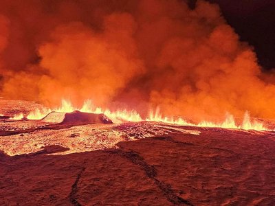 In pictures: Volcano spews lava after erupting in Iceland
