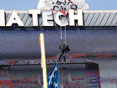 Skydiver crashes into Hokies' scoreboard, rescued