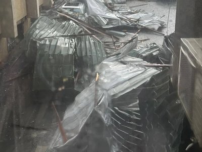 Storm in Lviv tore off the roof of the district administration, one of the trees fell on a trolleybus