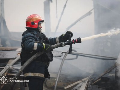 Russian strike drone attacked a civilian enterprise in Kharkiv: trucks caught fire, a woman and a child were injured