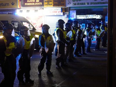 A police officer was injured during riots in London after France's victory over Morocco at the World Cup, while Paris celebrated peacefully