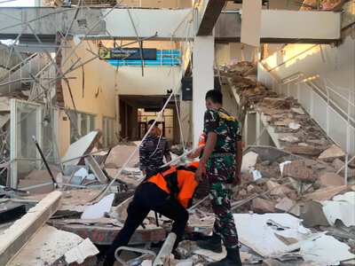 The death toll from a powerful earthquake in Indonesia has risen to 38