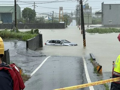 Four people went missing in Taiwan amid torrential rains, with a typhoon expected