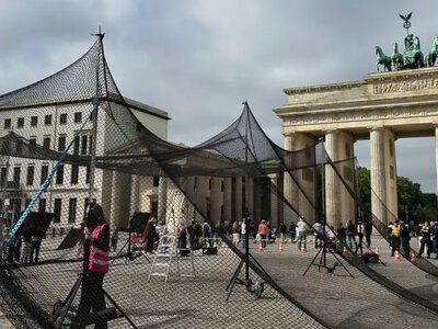 Berlin activists deploy anti-drone net near Brandenburg Gate to show support for Ukrainian cities