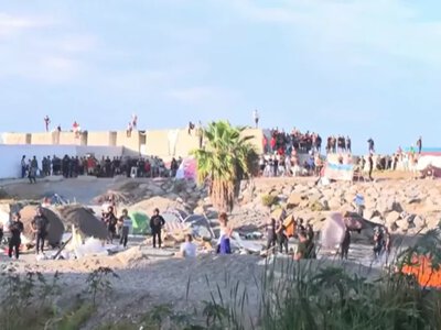 In Ceuta, a month after the influx of migrants, protesters set fire to their camp and clashed with police