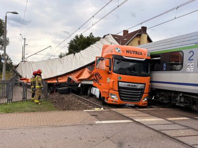 In Poland, a train carrying hundreds of passengers crashed into a truck that was stuck at a railway crossing