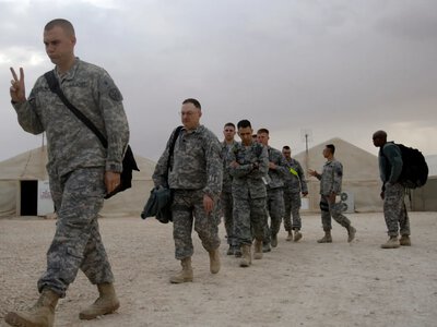 The United States will withdraw its remaining troops from Iraq by September 30, but pro-Iranian groups are refusing to disarm