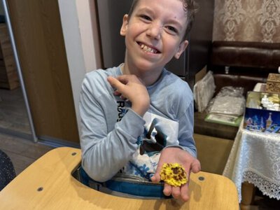 Solutions from Ukraine: 12-year-old boy with cerebral palsy uses AI to build website for candle workshop to support UAF and family home dream